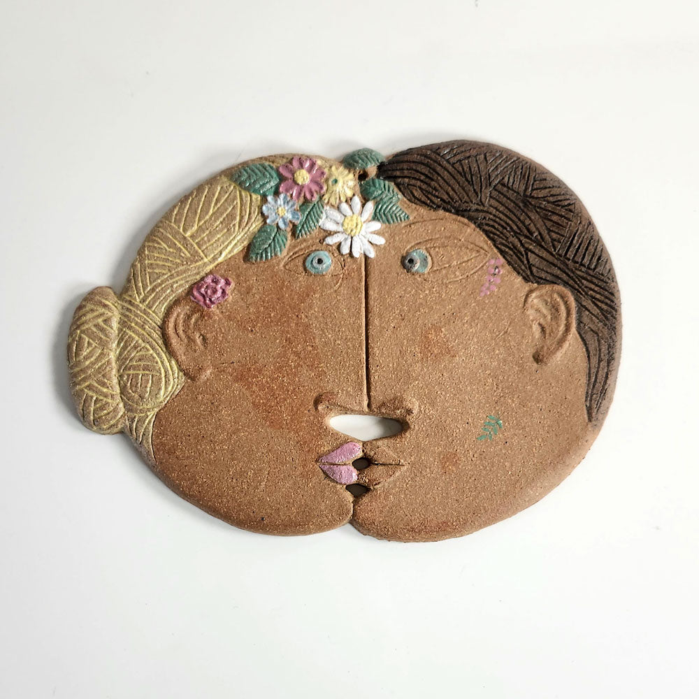 Stig Lindberg for Gustavsberg, Sweden, stoneware wall plaque of kissing couple L3893