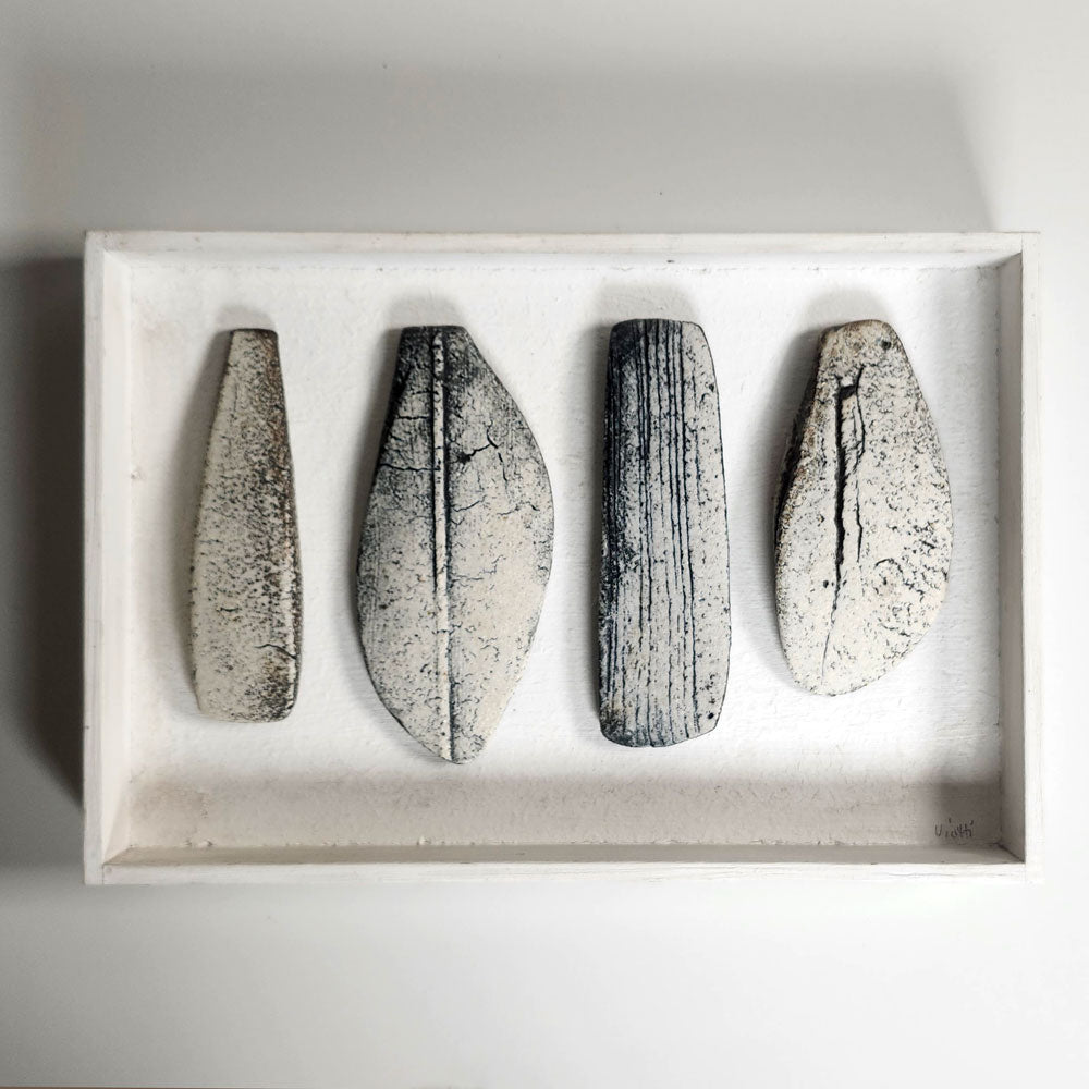 Ulla Viotti, Sweden, four stoneware forms mounted on wooden frame L3904