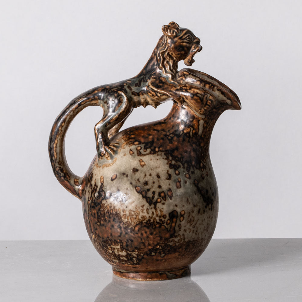 Bode Willumsen for Royal Copenhagen, Denmark, footed stoneware jug with lion handle K2279