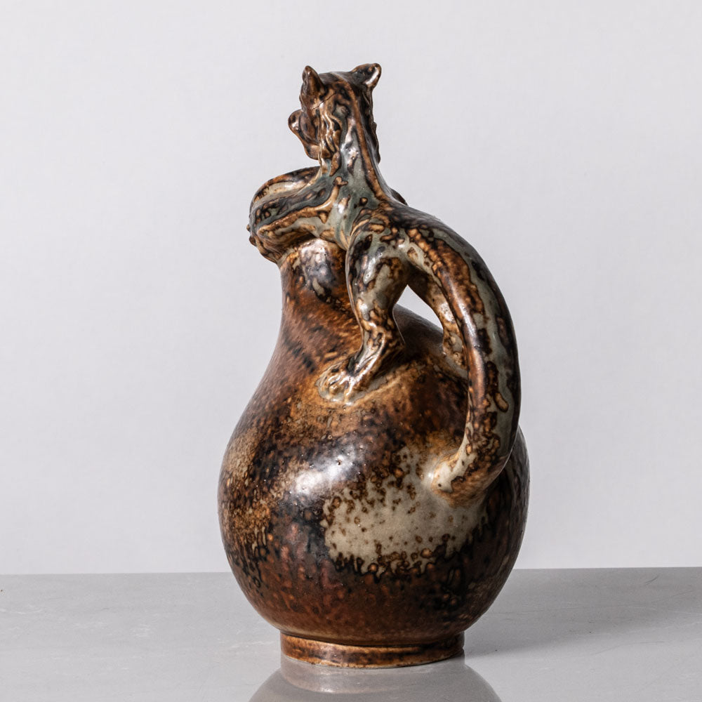 Bode Willumsen for Royal Copenhagen, Denmark, footed stoneware jug with lion handle K2279