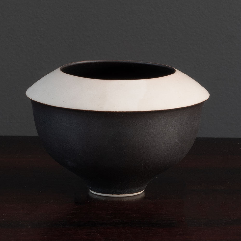 Karl Scheid, own studio, Germany
Unique porcelain vase with matte brown-black and white glaze