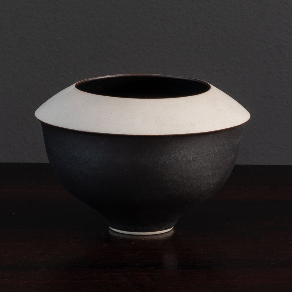 Karl Scheid, own studio, Germany
Unique porcelain vase with matte brown-black and white glaze