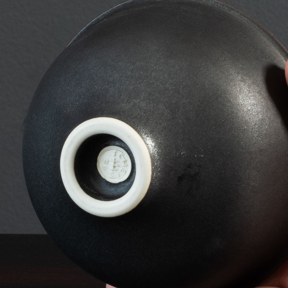 Karl Scheid, own studio, Germany
Unique porcelain vase with matte brown-black and white glaze