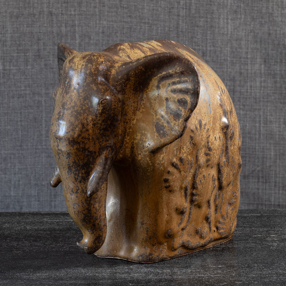 Arne Bang, Denmark, stoneware elephant with gold and brown glaze L3899