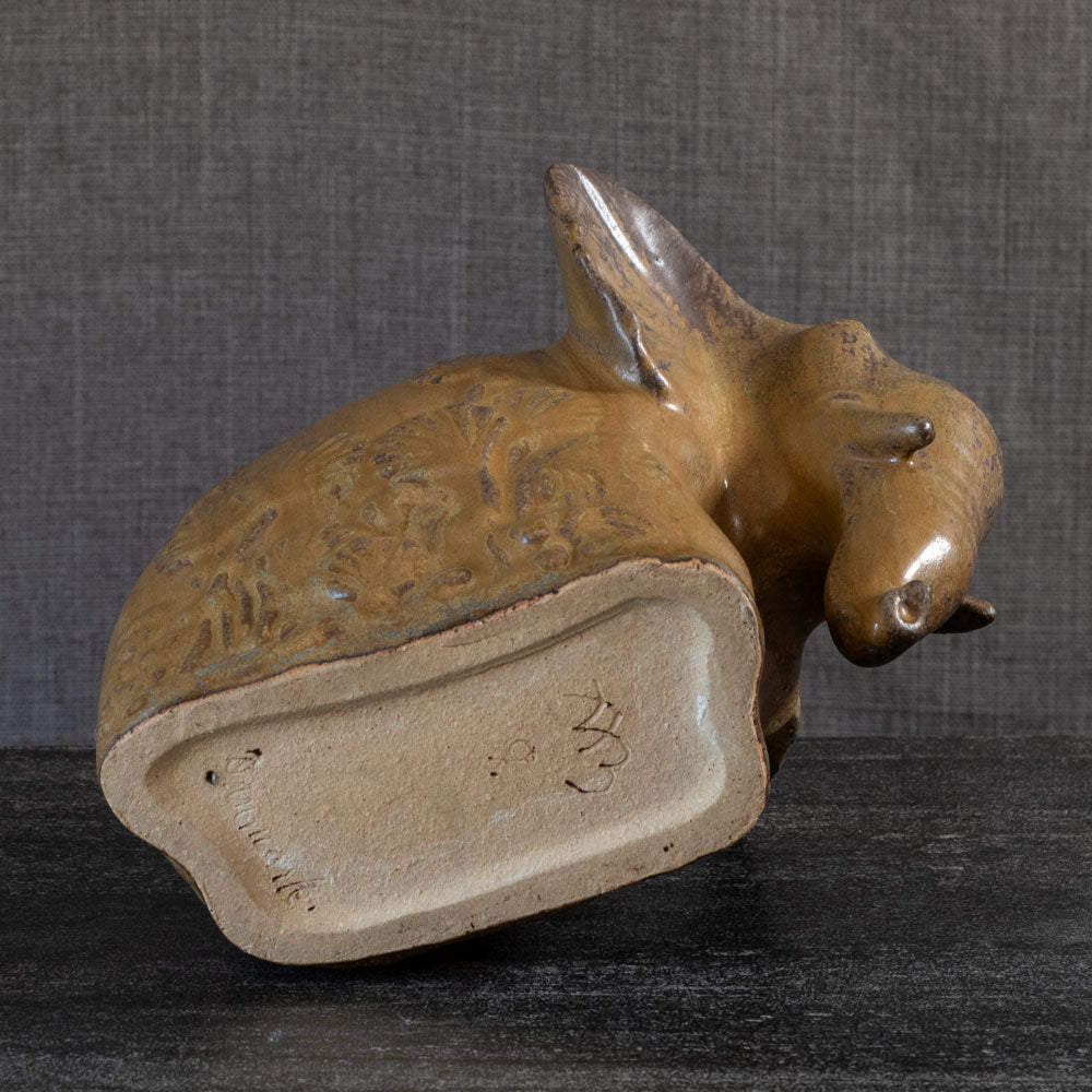 Arne Bang, Denmark, stoneware elephant with gold and brown glaze L3899