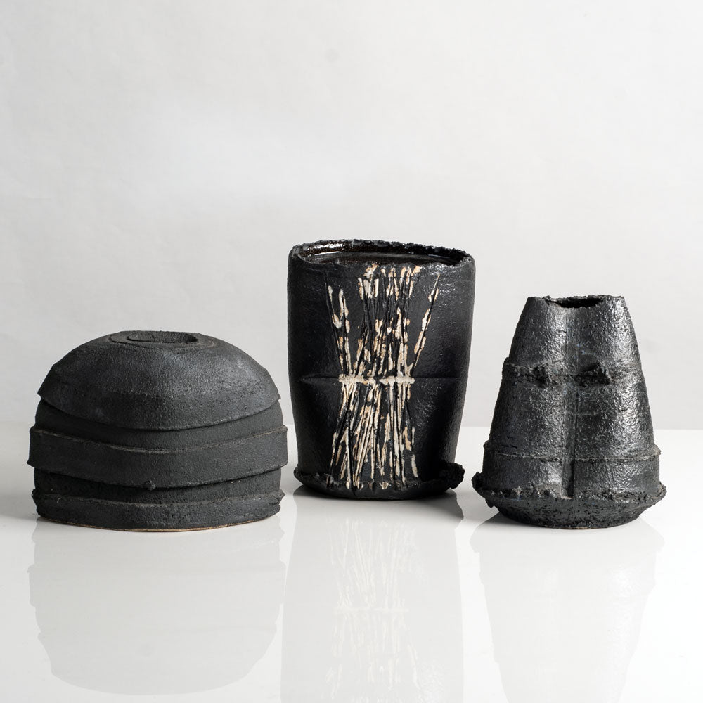 Group of vases with black glaze by Dan Kelly, UK