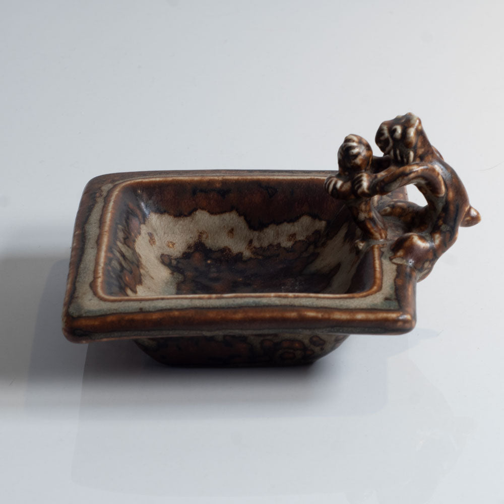 Bode Willumsen for Royal Copenhagen, Denmark, "The Tailor in Hell" square dish with sung glaze and sculptural form L3839