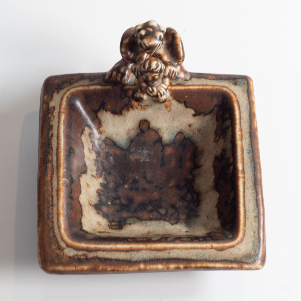Bode Willumsen for Royal Copenhagen, Denmark, "The Tailor in Hell" square dish with sung glaze and sculptural form L3839