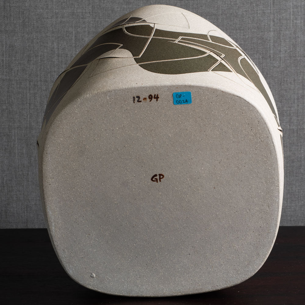 Gustavo Pérez, own studio, Mexico, irregularly shaped vessel with sliced exterior and matte black and beige glaze M4295