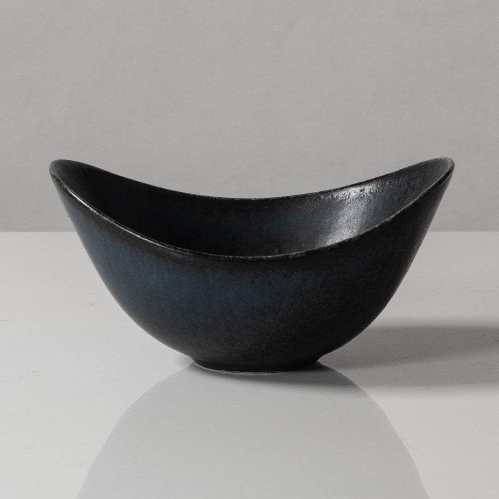 Gunnar Nylund for Rörstrand, Sweden, small ovoid bowl with black and blue matte glaze J1652