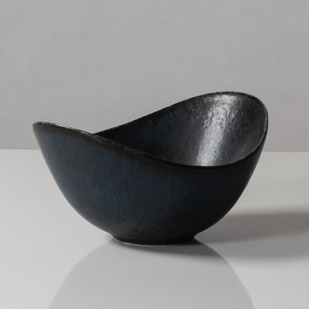 Gunnar Nylund for Rörstrand, Sweden, small ovoid bowl with black and blue matte glaze J1652