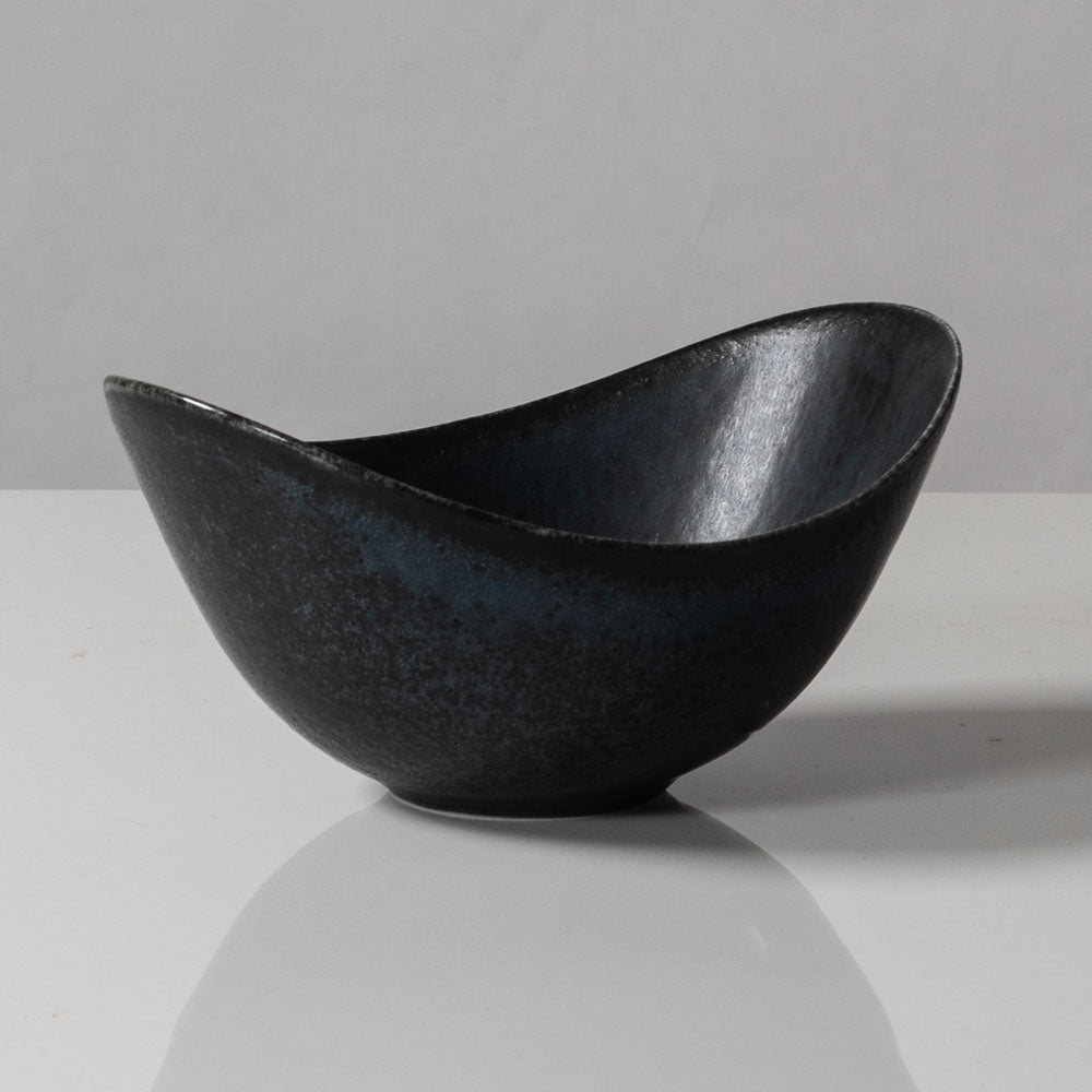 Gunnar Nylund for Rörstrand, Sweden, small ovoid bowl with black and blue matte glaze J1652