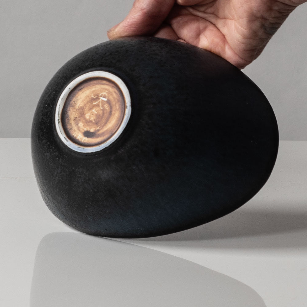 Gunnar Nylund for Rörstrand, Sweden, small ovoid bowl with black and blue matte glaze J1652