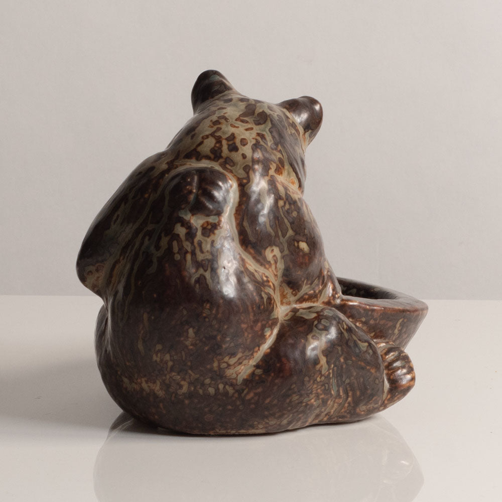 Knud Kyhn for Royal Copenhagen, Denmark, stoneware figure of a bear with a bowl M5757
