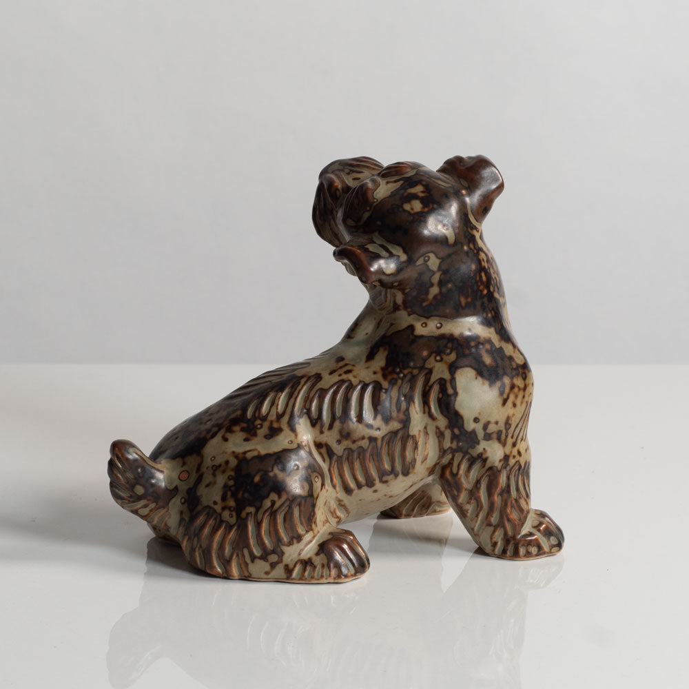 Knud Kyhn for Royal Copenhagen, Denmark, stoneware figure of a dog with Sung glaze M5722