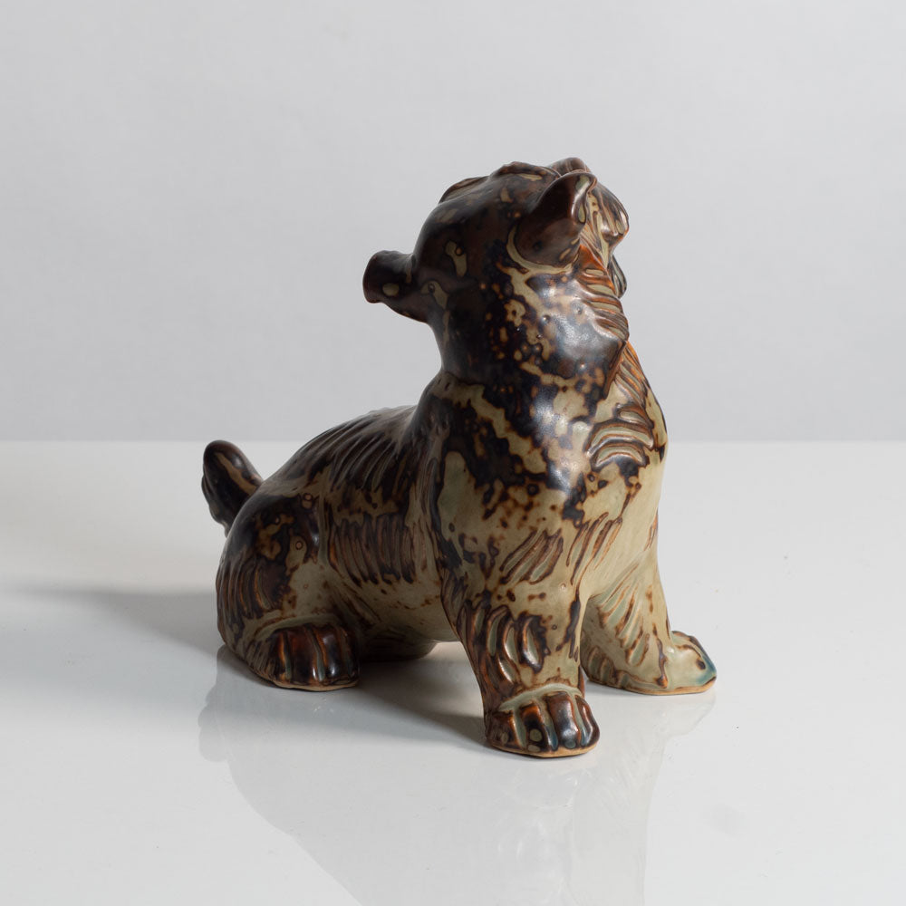 Knud Kyhn for Royal Copenhagen, Denmark, stoneware figure of a dog with Sung glaze M5722