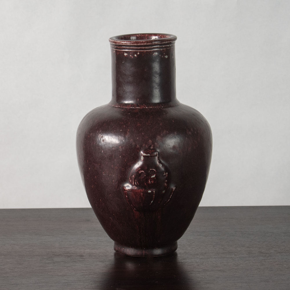 Jais Nielsen for Royal Copenhagen, Denmark, stoneware vase with figures in relief and oxblood glaze N2308