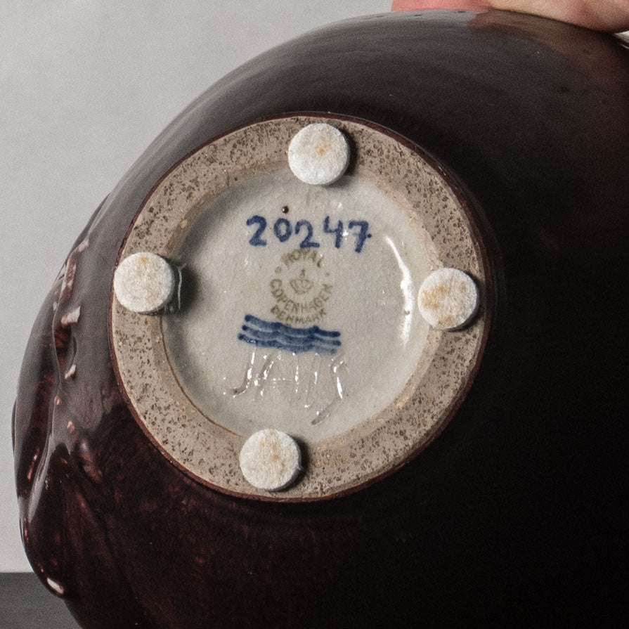 Jais Nielsen for Royal Copenhagen, Denmark, stoneware vase with figures in relief and oxblood glaze N2308