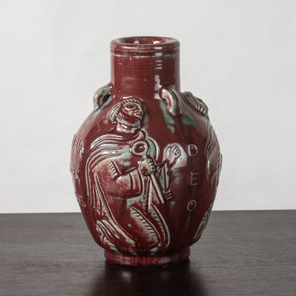Jais Nielsen for Royal Copenhagen, Denmark, stoneware vase with oxblood glaze and figures in relief N1243