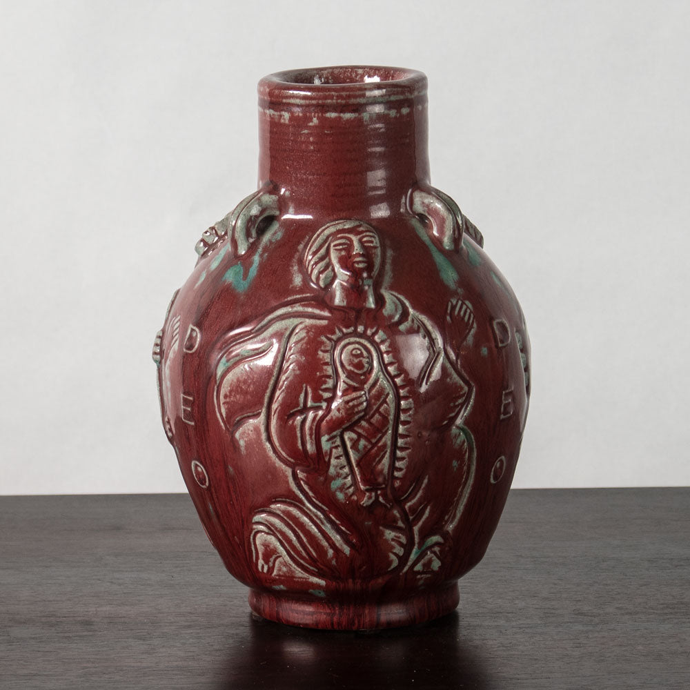 Jais Nielsen for Royal Copenhagen, Denmark, stoneware vase with oxblood glaze and figures in relief N1243