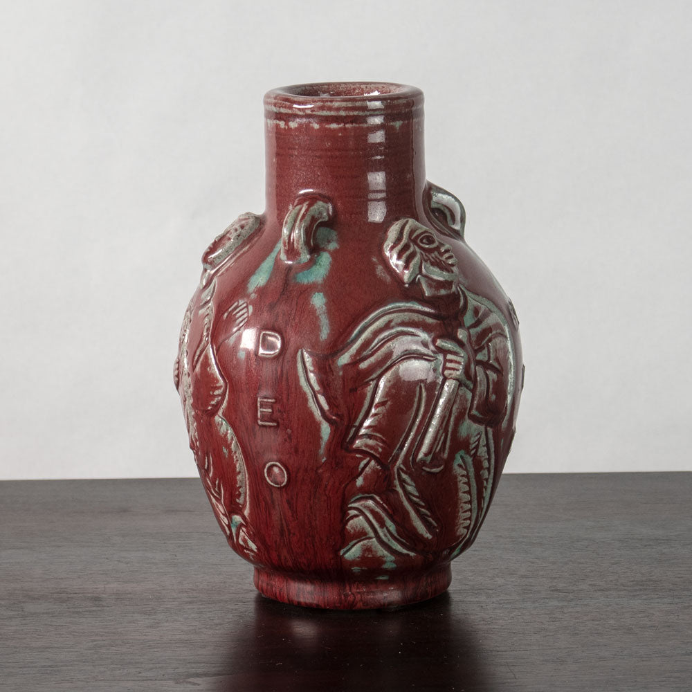 Jais Nielsen for Royal Copenhagen, Denmark, stoneware vase with oxblood glaze and figures in relief N1243