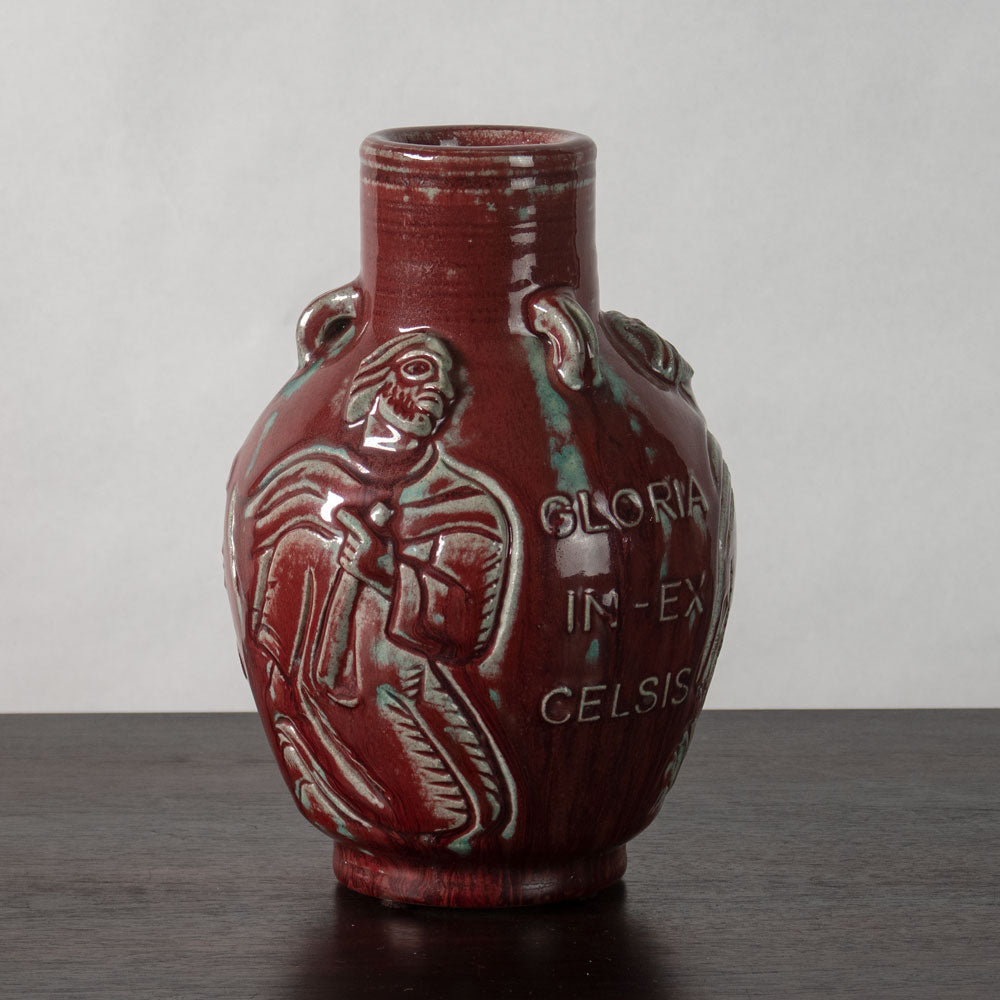 Jais Nielsen for Royal Copenhagen, Denmark, stoneware vase with oxblood glaze and figures in relief N1243