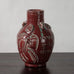 Jais Nielsen for Royal Copenhagen, Denmark, stoneware vase with oxblood glaze and figures in relief N1243