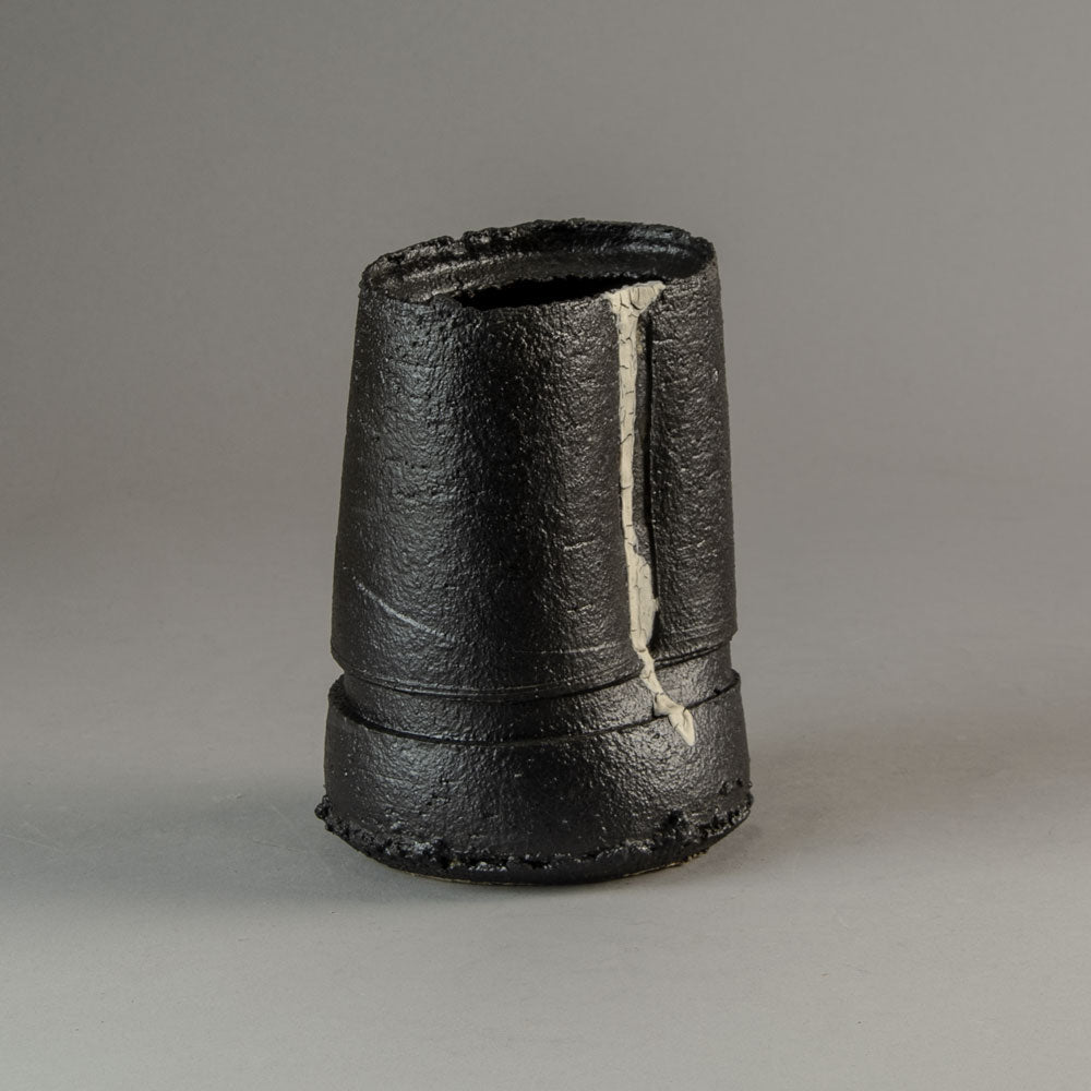 Dan Kelly, UK, stoneware pot with matte black glaze and white streak H1203