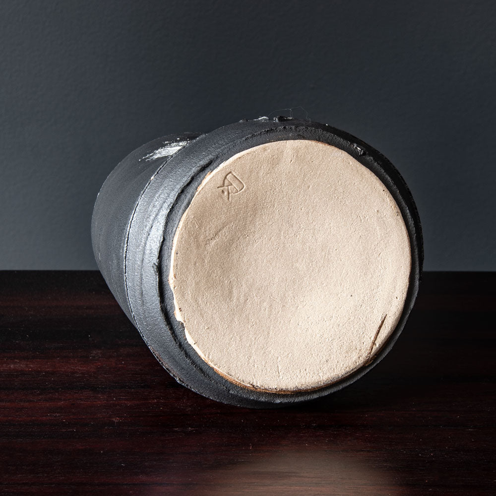 Dan Kelly, UK, stoneware pot with matte black glaze and white streak H1205