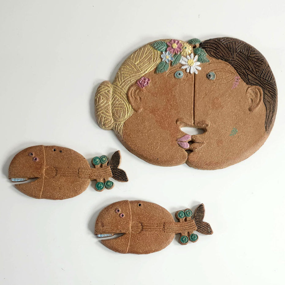 Group of small wall plaques by Stig Lindberg for Gustavsberg, Sweden