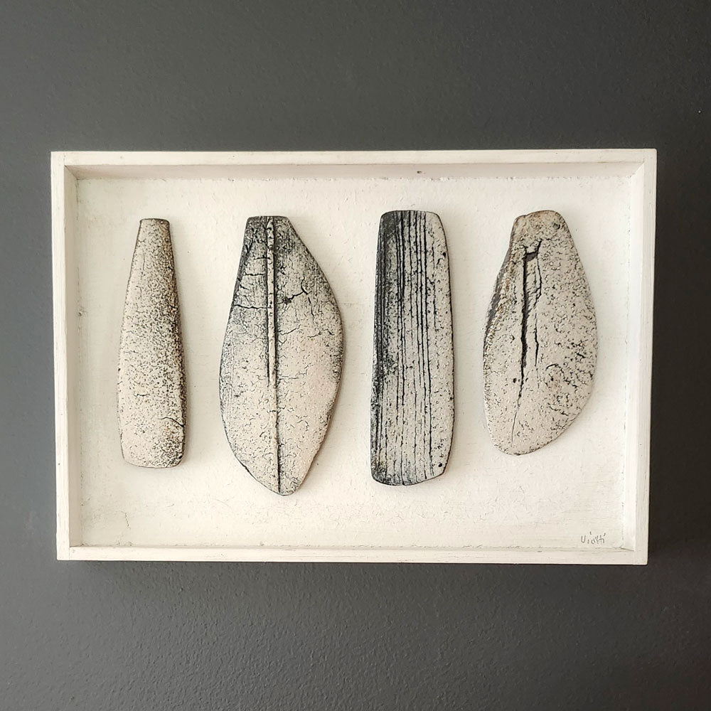 Ulla Viotti, Sweden, four stoneware forms mounted on wooden frame L3904
