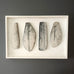Ulla Viotti, Sweden, four stoneware forms mounted on wooden frame L3904