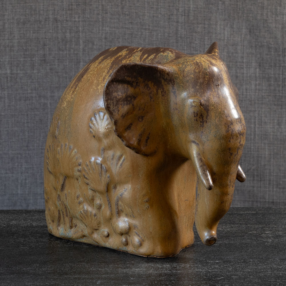 Arne Bang, Denmark, stoneware elephant with gold and brown glaze L3899
