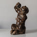 Knud Kyhn for Royal Copenhagen, Denmark, stoneware faun figure eating grapes with Sung glaze