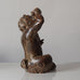 Knud Kyhn for Royal Copenhagen, Denmark, stoneware faun figure eating grapes with Sung glaze