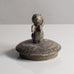 Stoneware lid with figure of cherub with green matte glaze by Arne Bang J1091