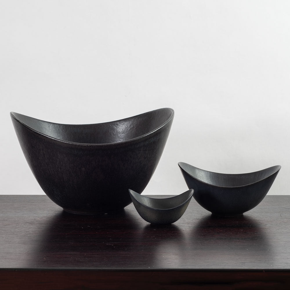 Group of three black bowls by Gunnar Nylund for Rörstrand