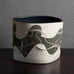 Gustavo Pérez, own studio, Mexico, irregularly shaped vessel with sliced exterior and matte black and beige glaze M4295