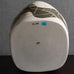 Gustavo Pérez, own studio, Mexico, irregularly shaped vessel with sliced exterior and matte black and beige glaze M4295