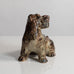 Knud Kyhn for Royal Copenhagen, Denmark, stoneware figure of a dog with Sung glaze M5722